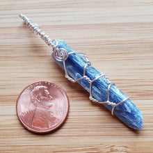 Load image into Gallery viewer, blue kyanite amulet coming up rainbows
